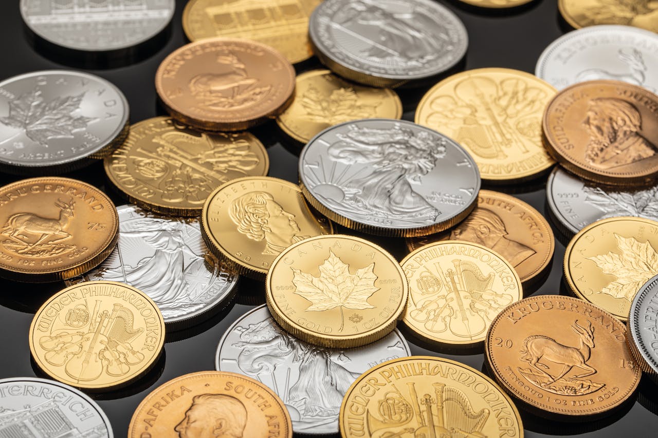 A detailed view of various gold and silver coins, ideal for financial themes.